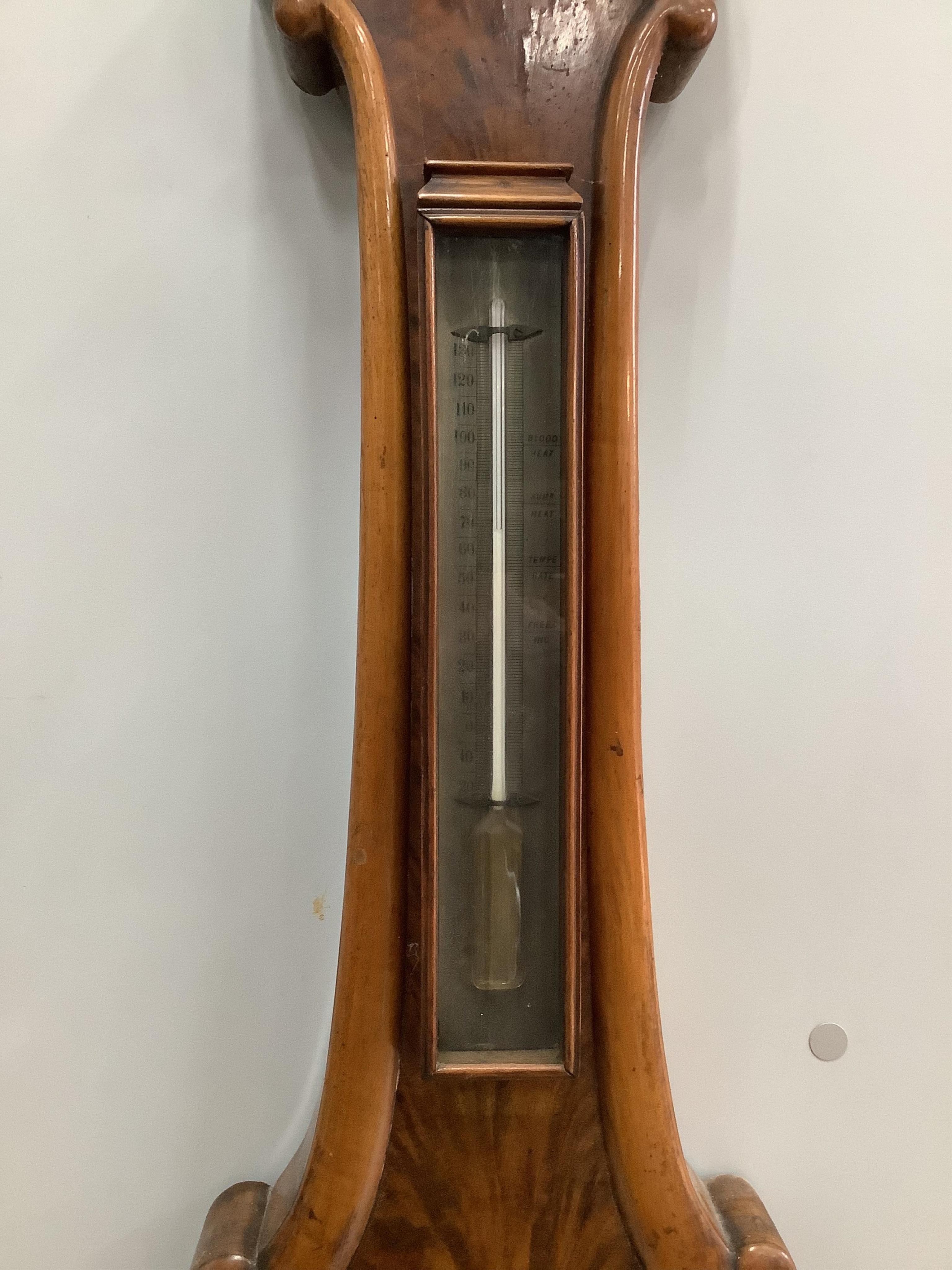 P. Cattaneo, High Street, Croydon. An early Victorian flamed mahogany wheel barometer, height 114cm. Condition - fair to good